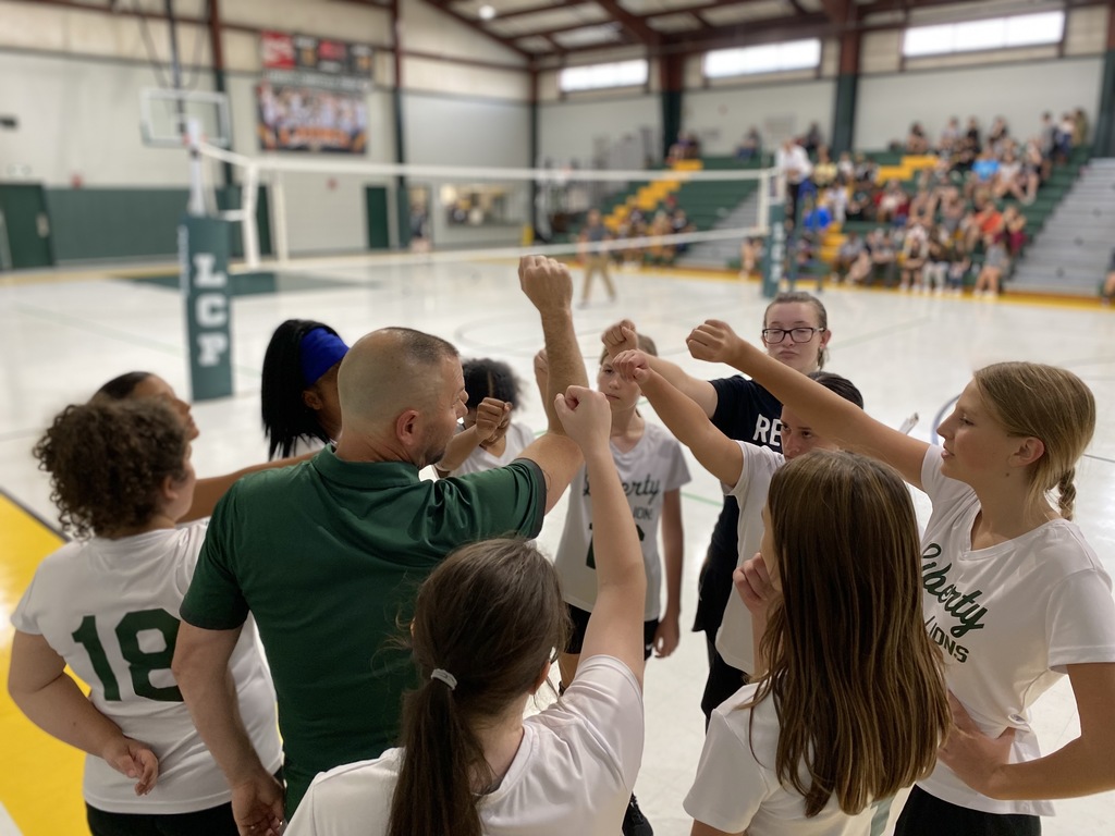 JV Volleyball in their huddle before the game